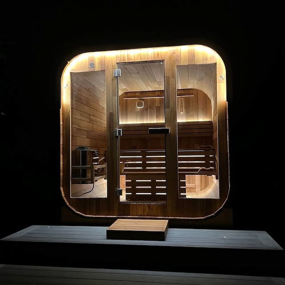A wooden sauna lit at night with warm feature lighting by Mylec Electrical Solutions