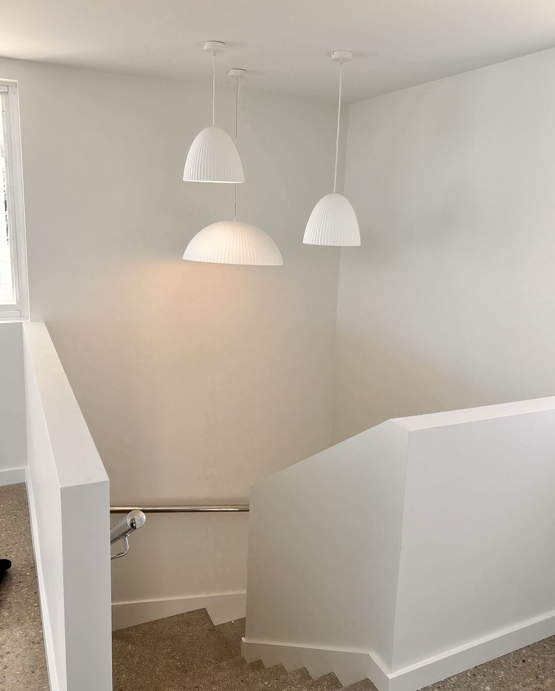 Staircase with railing and window, rewired and relit by Mylec Electrical Solutions